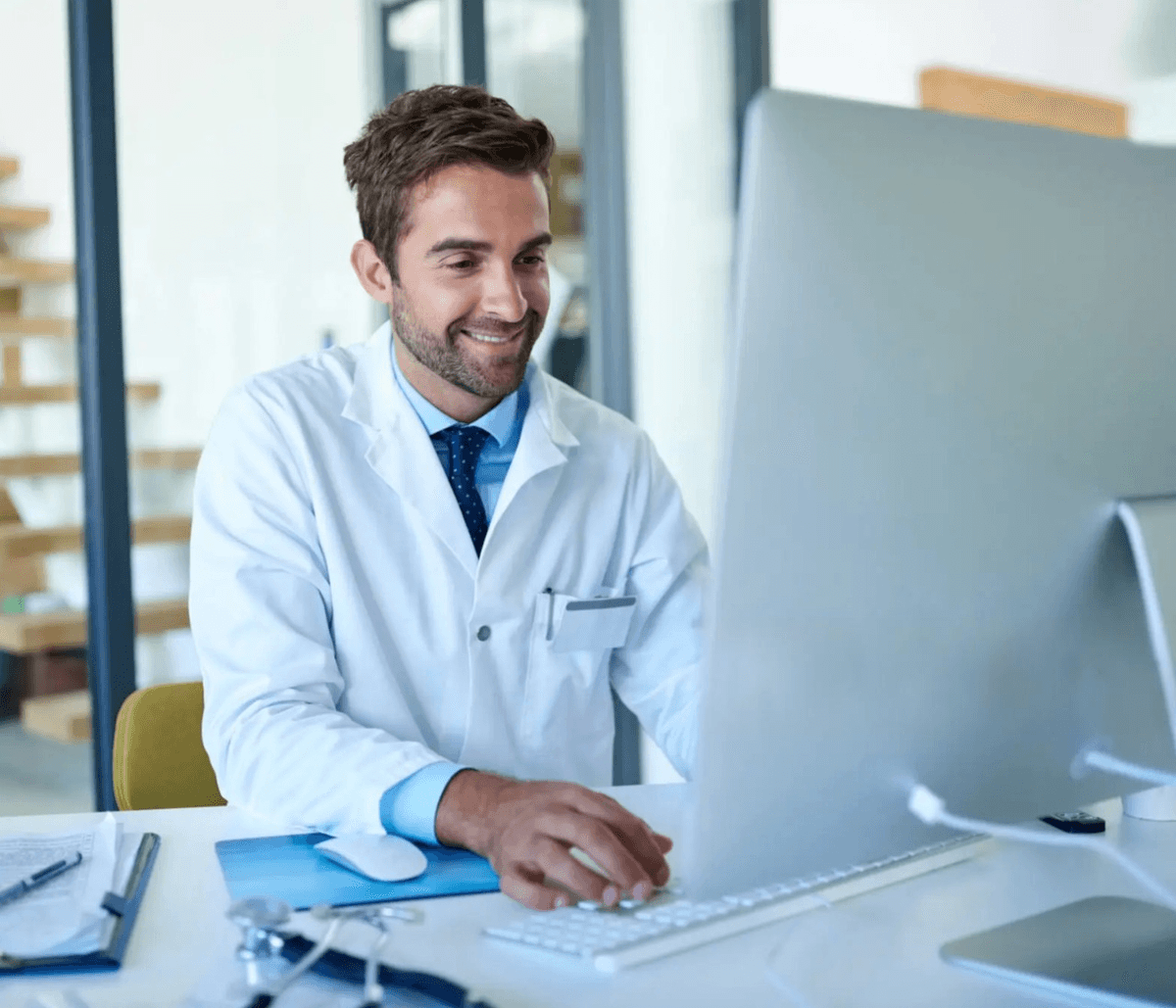 Smiling healthcare professional using Marilia AI to focus on patient care rather than documentation